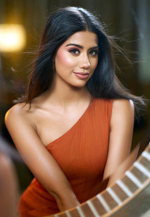 Miss India runner up Ritika Khatnani in our burnt orange one-shoulder tucked mini dress.