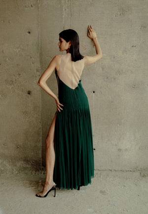 Decore yourself with our long maxi dress which is made from georgette. The green maxi dress features cut out on both sides and intricate pleating on the back. In addition, a head-turning sleeveless design makes this perfect for all the seasons. Walk like 