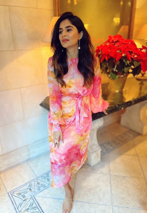 This pink and yellow sheer  dye print midi dress with a  sequin dress underneath can be styled in multiple ways. Made in chiffon and crepe this ensemble with handcrafted bandeau is perfect for the next date or formal evenings. Wear the piece in summer or 