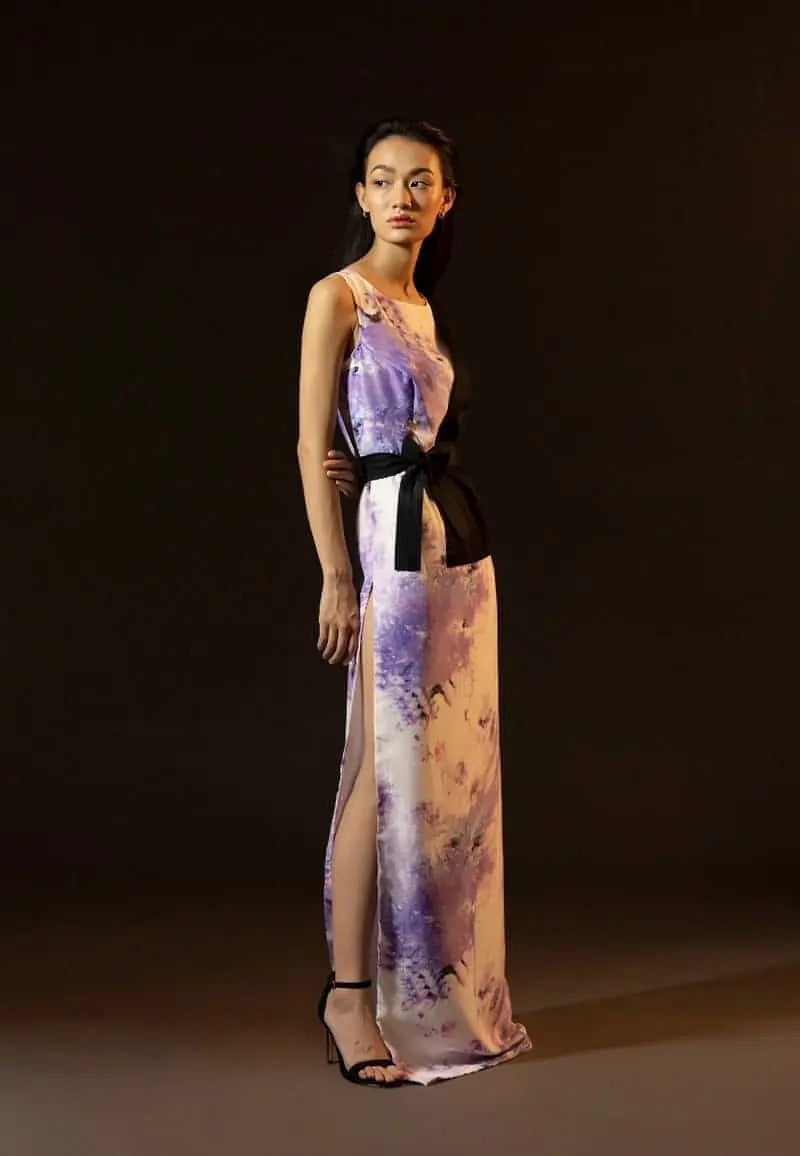 Mannat Guptas new half jacket style collection for women, this tie-dye straight maxi dress is crafted from silk and cotton. The black half-jacket style comes with a wrap around belt and a dramatic side slit which makes your look modern. The sleeveless maxi dress also features a high side slit for extra drama. Increase your confidence with this statement piece.