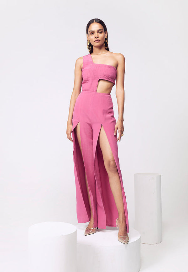 Mannat Gupta’s women’s pink one-shoulder cut out bodysuit and pink high-waisted flared slit pants co-ord set which will give you a versatile look in evening parties or at your next birthday bash. Made from pure silk crepe and pleated on both sides, it is handcrafted with a concealed zip closure on the side. Pair this fuchsia co-ord set up with high end premium jewelry to complete the look.