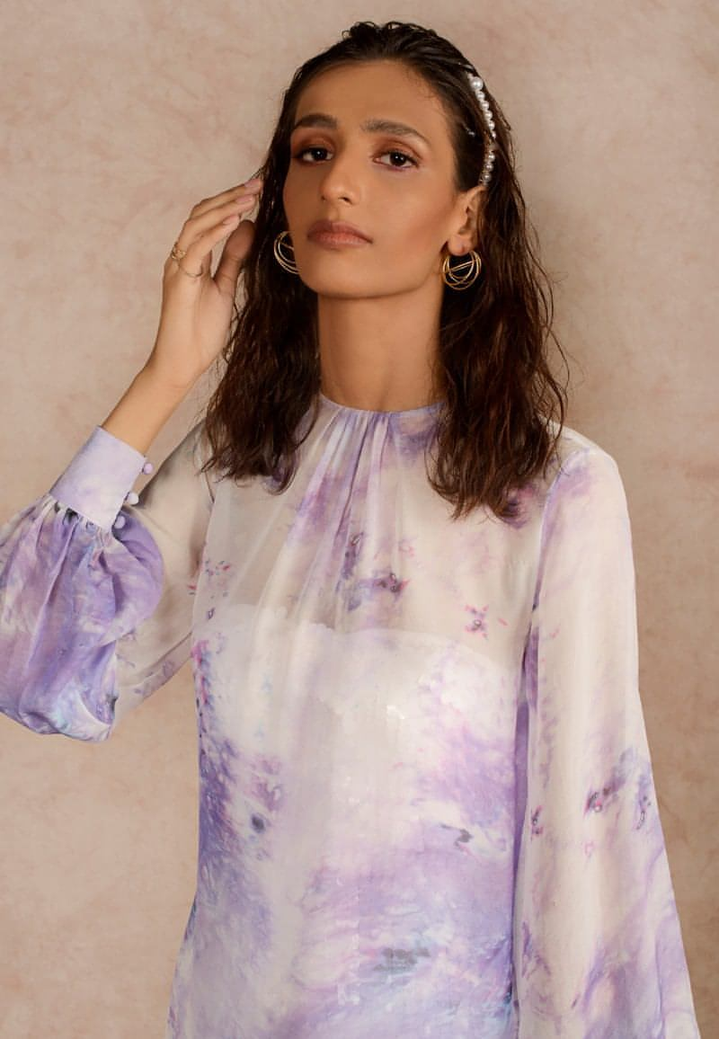 This purple and white sheer dye print midi dress with a  sequin dress underneath can be styled in multiple ways. Made in chiffon and crepe this ensemble with handcrafted bandeau is perfect for the next date or formal evenings. Wear the piece in summer or style it in winter with an overlap jacket and stylish boots
