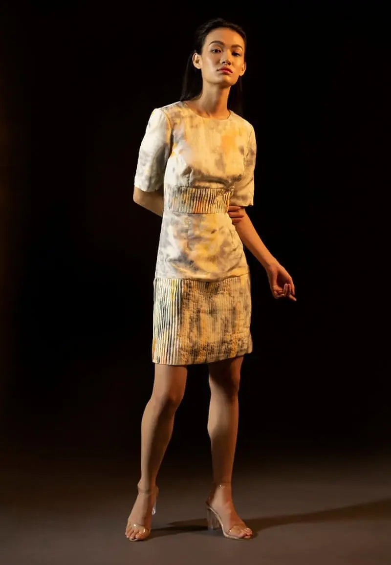 Womens mini dress collection, this half-sleeved mini dress is made from luxe tie-dye silk in grey and yellow. The shoulder pads give it a structured and strong look. Take this versatile piece from day to night or from summer to winter in seconds. Pair it with heeled sandals or flats and minimal gold jewelry to complete the look.